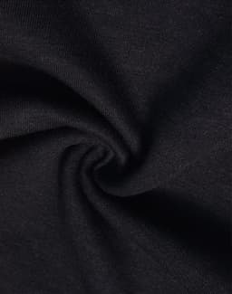 A close-up of black poly/cotton terry fabric, displaying a soft, textured surface.
