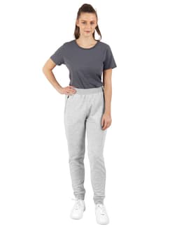 Grey poly/cotton terry sweat pants worn by a model, paired with a grey T-shirt and white shoes.