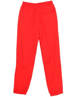 Red track pants with an elastic waistband and a single pocket on the back. Includes a branding logo.