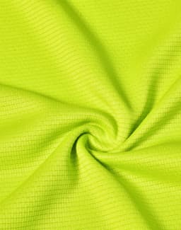 A close-up of lightweight, textured fabric in vibrant lime green, suitable for performance t-shirts.