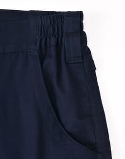A navy unisex cotton stretch ripstop segmented work pant with an elastic waistband and pocket detail.