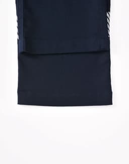 A pair of navy blue unisex cotton stretch ripstop segmented work pants, featuring a fold-over leg design.
