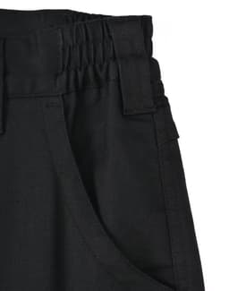 A close-up of unisex cotton stretch ripstop work pants in black, featuring a textured waistband and side pockets.