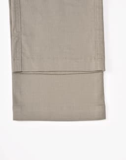 Unisex cotton stretch ripstop work pants in a light beige shade, showcasing a smooth, flat hem at the cuff.