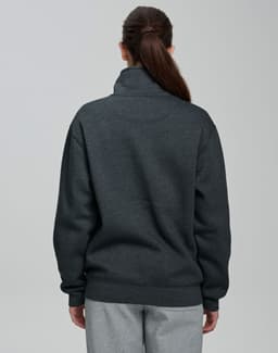 A dark grey 1/2 zip collar polar fleece jumper with a relaxed fit and a plain back. Features a branding logo.