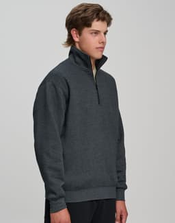 A casual 1/2 zip collar fleecy jumper in dark grey, featuring a branded logo. Suitable for cool weather.