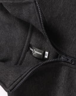 A 1/2 zip collar fleecy jumper in dark grey, featuring a hang tag and a zip closure. It has a logo.