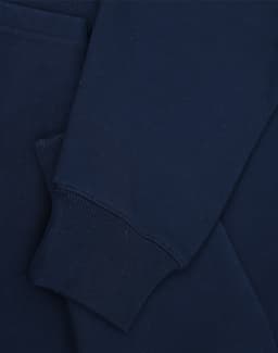 A navy unisex premium fleece oversized hoodie with a cuff and pocket detail. Features a logo.