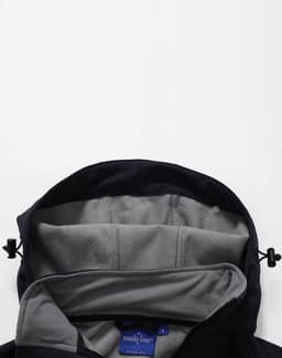 A navy softshell full zip hoodie with a grey interior, featuring an adjustable hood and a logo.