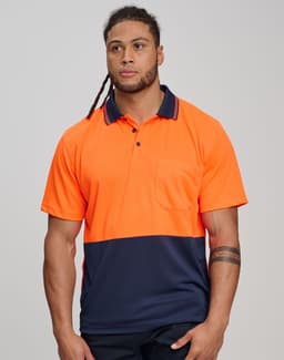 A safety polo shirt in high-visibility orange with a navy blue bottom section and a pocket, featuring a logo.