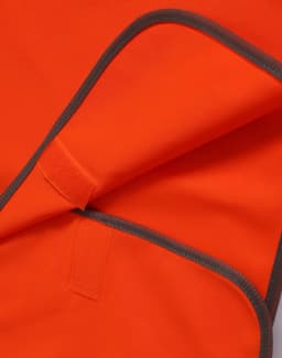 An orange Hi-Vis kid's safety vest with grey trim, featuring a Velcro closure.