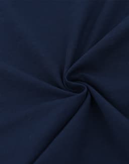 A close-up of navy blue cotton fabric, showcasing a smooth and soft texture with a spiral pattern.
