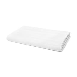 A folded white blanket with a textured design, featuring a subtle logo.