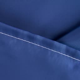 A close-up of a navy fabric, featuring a smooth texture and contrasting white stitching.
