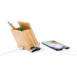 A bamboo pencil holder with pens inside, featuring a wireless charger for a smartphone.