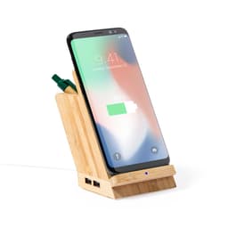 A bamboo wireless charger with a phone displaying a charging indicator and compartments for pens.