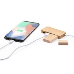 A wooden USB drive connected to a smartphone with a charging cable. The drive features a minimalist design in natural wood tones.