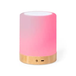 A Bluetooth speaker with a gradient pink and white design and a bamboo base, featuring a logo on the front.