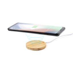 A wireless charger with a wooden base and a smartphone placed above it, indicating charging in progress.