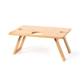 A bamboo table with a natural finish, featuring two circular cutouts and angled legs for stability.