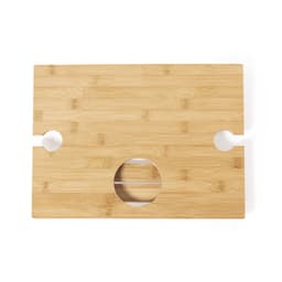A bamboo table with a smooth surface, featuring circular cutouts on both ends. It has a natural wood finish.