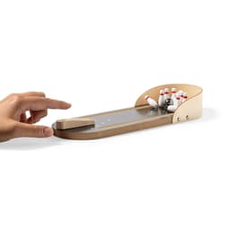 A tabletop bowling game featuring a wood finish and miniature bowling pins. Includes a finger-operated launching mechanism.