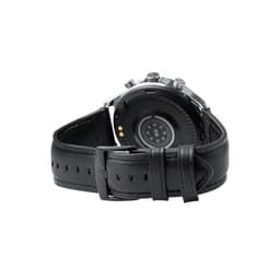 A smart watch with a black leather strap, featuring a round dial and a logo on the back.