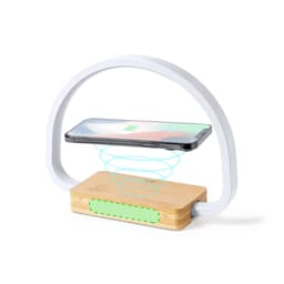 A wireless charger with a bamboo base and a white arch design, featuring a smartphone hovering above.