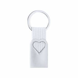 A silver keyring featuring a textured white strap with a heart-shaped cutout. Includes a circular ring attachment.