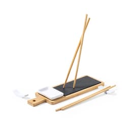 A bamboo sushi set featuring chopsticks, a serving board, and a small dish, with a black and white colour scheme.