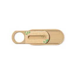 A beige phone accessory with a circular opening, featuring a simple design and a logo.