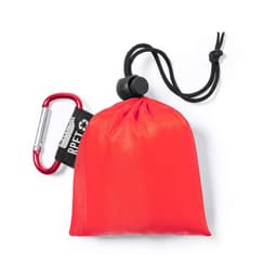 A red poncho packaged in a pouch with a drawstring and a carabiner clip attached. The pouch has a logo.