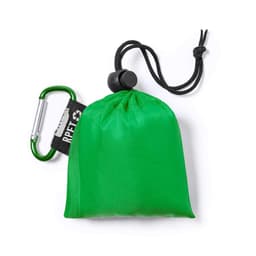 A green poncho packed into a small pouch with a drawstring and a carabiner attached.