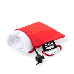 A red poncho neatly packed in a pouch with a white interior and a carabiner attached.