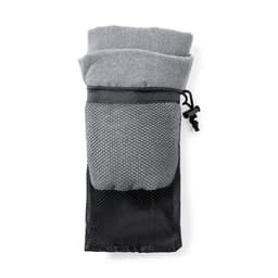 A grey towel with a black mesh storage pouch, featuring a drawstring closure and a brand logo.