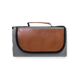 A grey picnic blanket with a brown leather flap and a carrying handle. It also features a logo on the side.