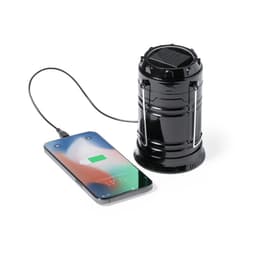 A black power bank shaped like a lantern, connected to a smartphone displaying a charging icon.