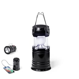 A black lantern with a solar panel on top, accompanied by a smaller flashlight and a power bank charging a phone.
