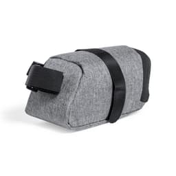 A grey Ritok bag with a black strap, featuring a simple, textured design. It has a logo on one side.