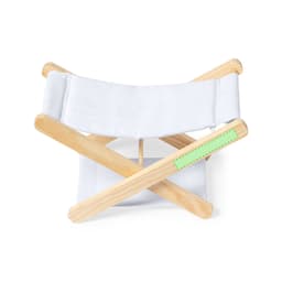 A wooden headrest with a white fabric band and a green accent. Features a folding design for easy storage.