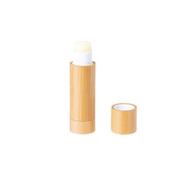 A bamboo lip balm tube with a white product inside and a removable cap. The bamboo has a natural finish.