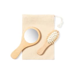 A wooden hand mirror and a hairbrush, presented in a natural fabric pouch. Both items are light in colour.
