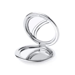 A shiny silver compact mirror with a reflective surface, featuring a simple, round design and a logo.