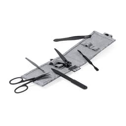 A grey grooming kit featuring black scissors, clippers, and various tools for hair and nail care.