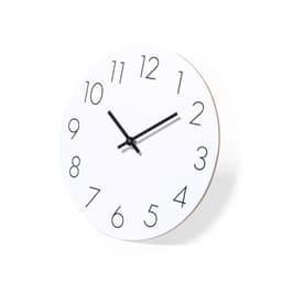 A round white wall clock with bold black numerals and black hands, featuring a minimalist design.