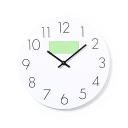 A wall clock featuring a white face, bold black numbers, and black hands, with a green rectangular accent.