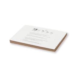 A Zomek Notebook featuring a white surface with printed instructions, resting on a light brown base. It has a logo.