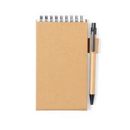 A brown notebook with a spiral spine and a black pen attached. The cover is made of kraft paper.