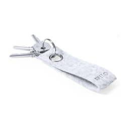 A grey felt keyring with a metal ring, holding several silver keys. It features a small logo on the strap.