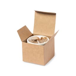 A brown cardboard gift box with an open lid containing a white container wrapped in clear plastic.